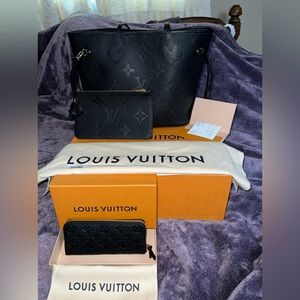 Louis Vuitton black Neverfull MM. Comes with black Clémence wallet.
